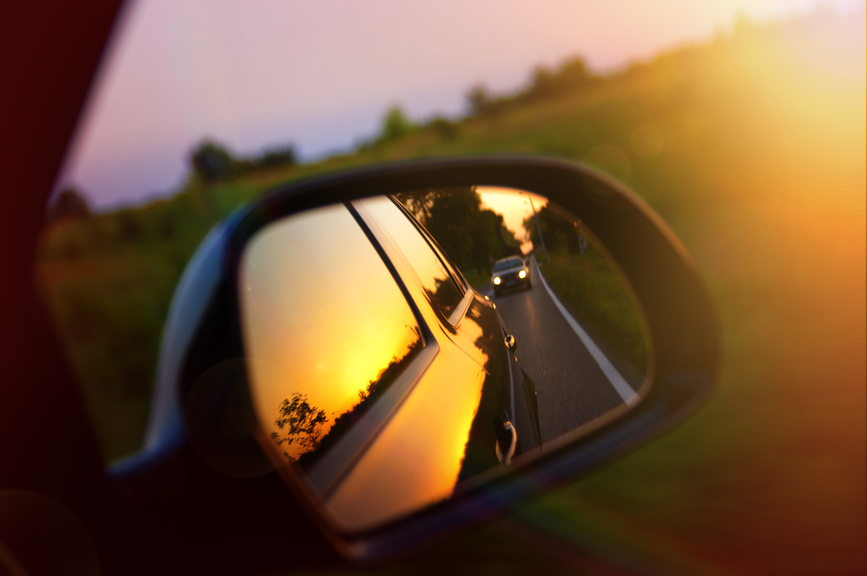Driving at sunset - rear view mirror